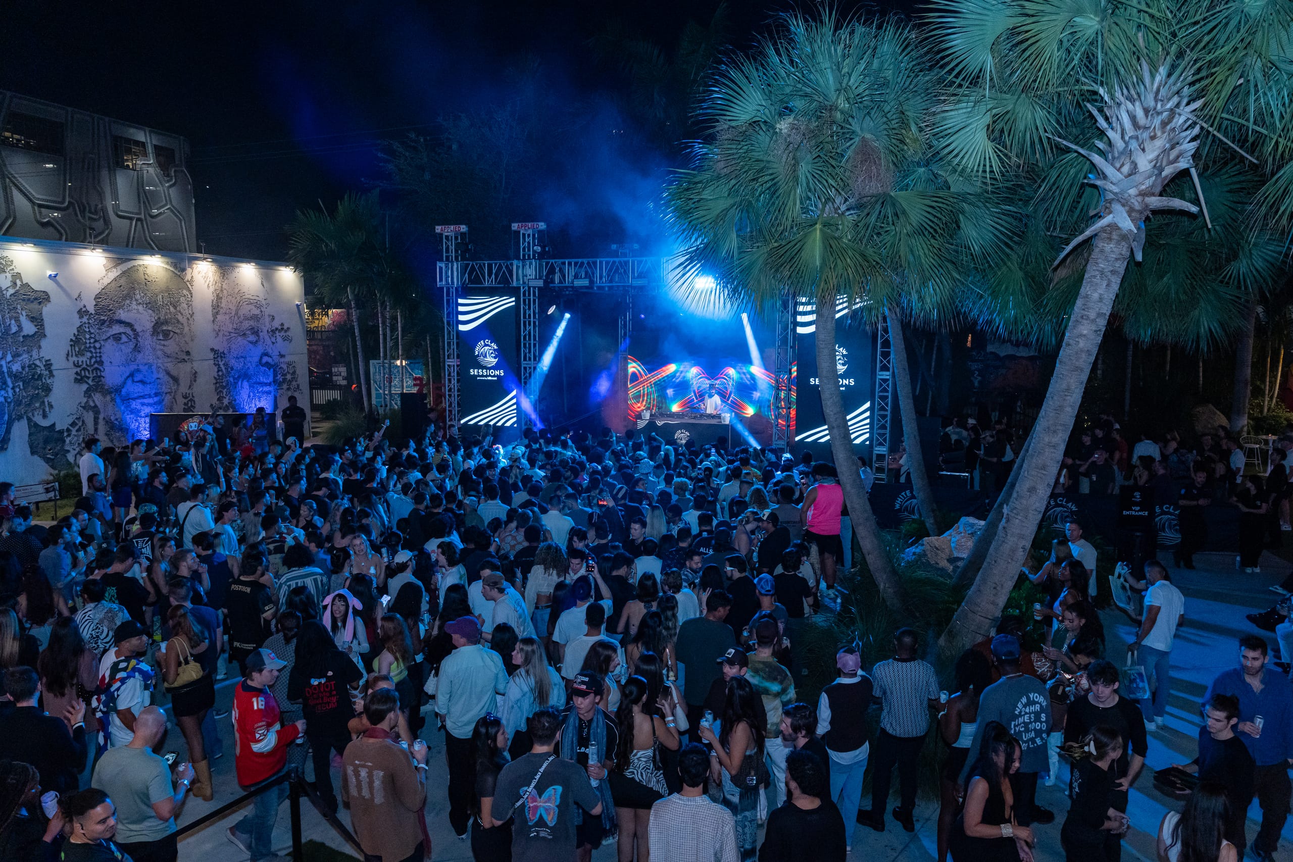White Claw concert activation with a crowd in the Wynwood Walls garden