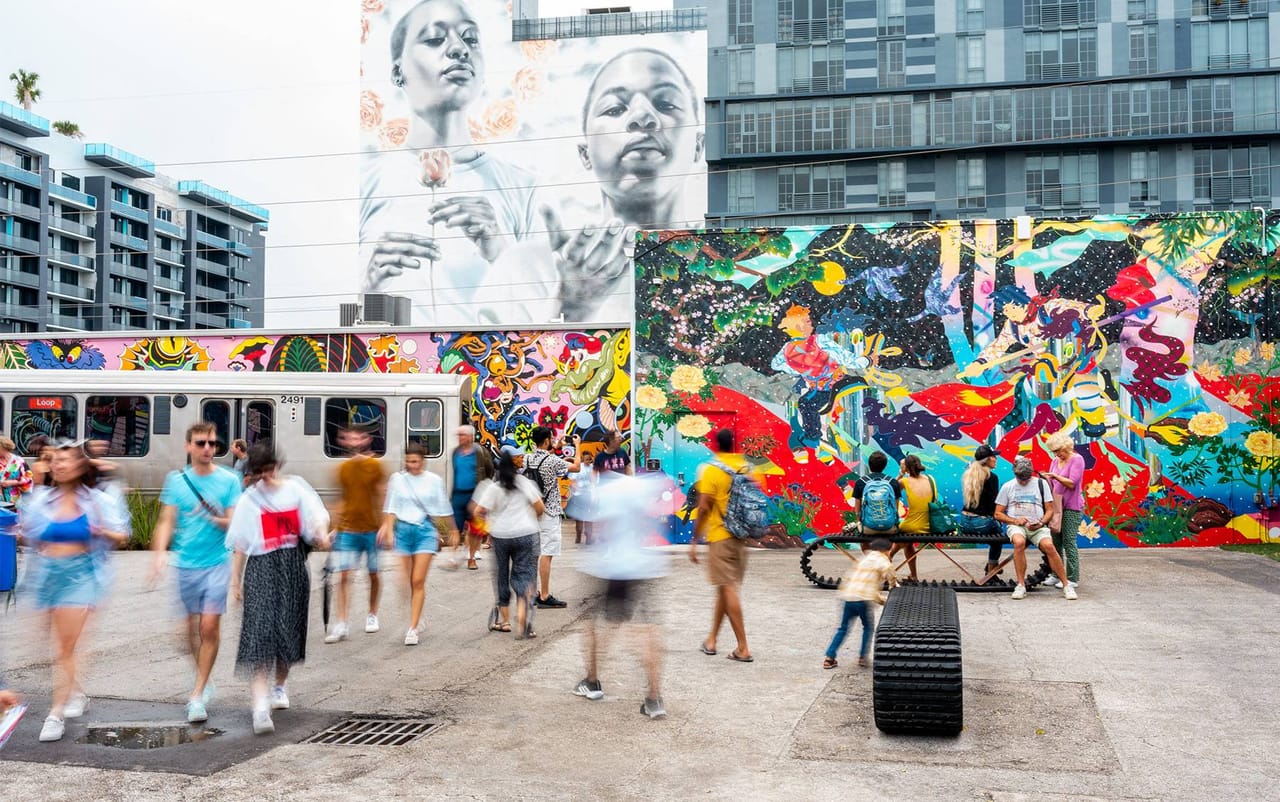 Visitors and murals at Wynwood Walls in Miami